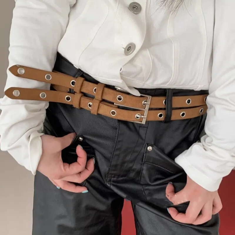 

Женский замшевый пояс с вырезами и пряжкой