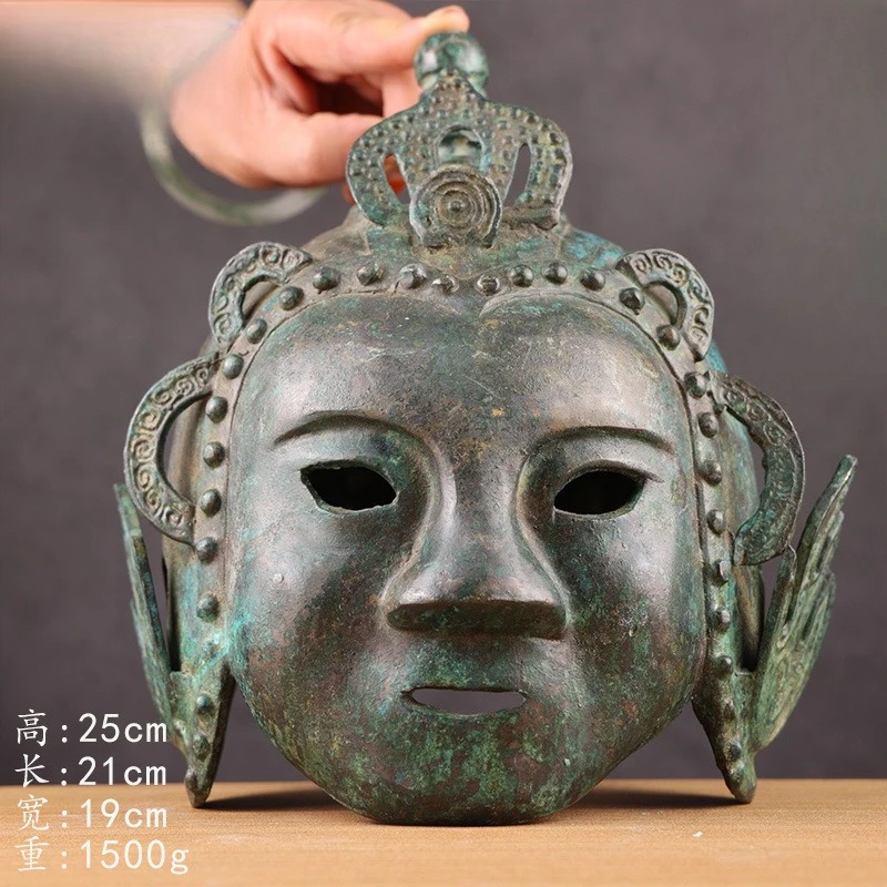 Bronze Shang Dynasty human face helmet film and television props antique collection museum exhibition artwork