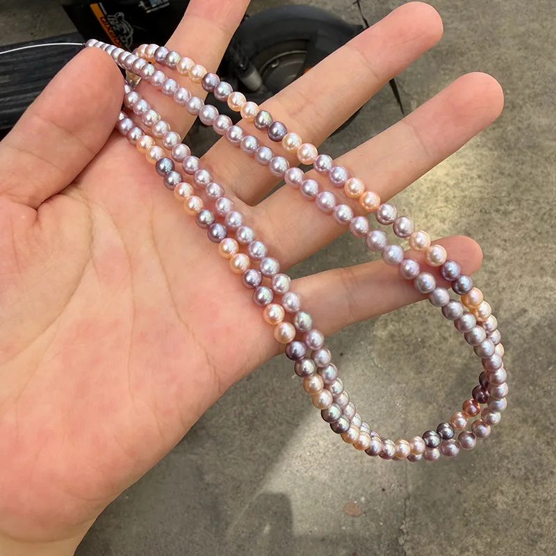 south sea colorful AAAA 5-5.5mm natural pearl strong light powder purple colored round beads. Approximately 87 beads 18in 925s