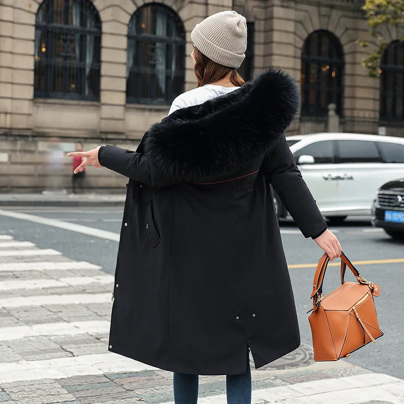 เสื้อโค้ทกันหนาวทรงพาร์กาแบบยาวสำหรับผู้หญิง มีฮู้ดถอดได้ แต่งขนเทียม ทรงเข้ารูป ​