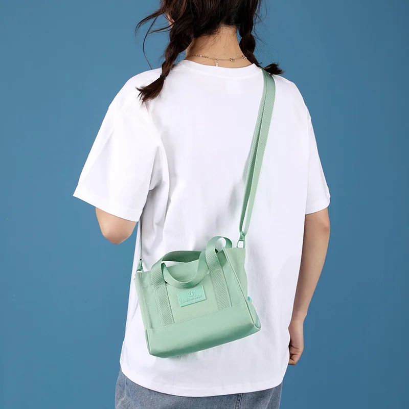 Bolsos cruzados para mujer, Mini bolso de tela de transporte, diseño de nicho de nailon, gran capacidad, bolso Bento para mamá