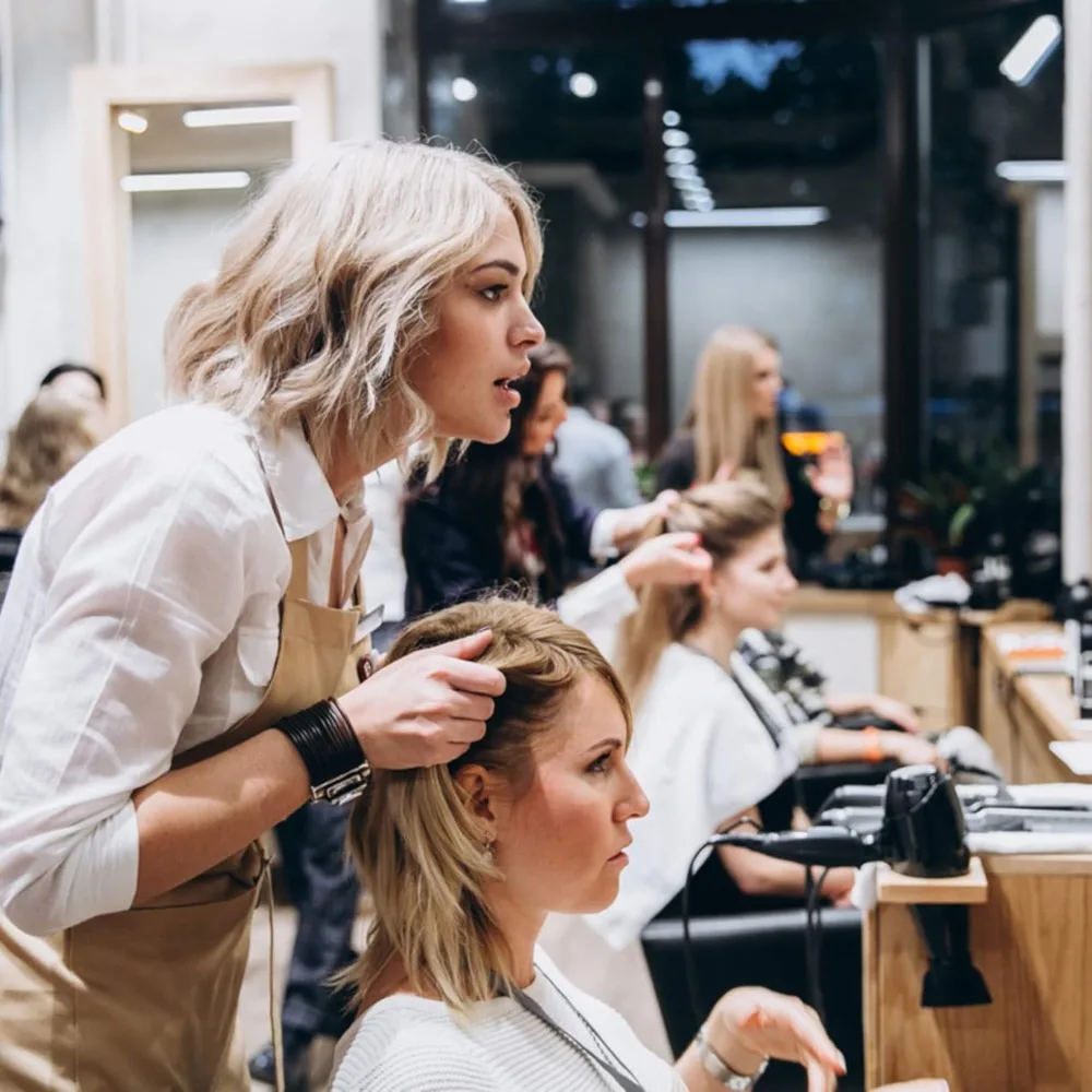 理髪椅子サロンチェア、スタイリングサロン機器用の高さ調節可能な油圧ポンプ付き