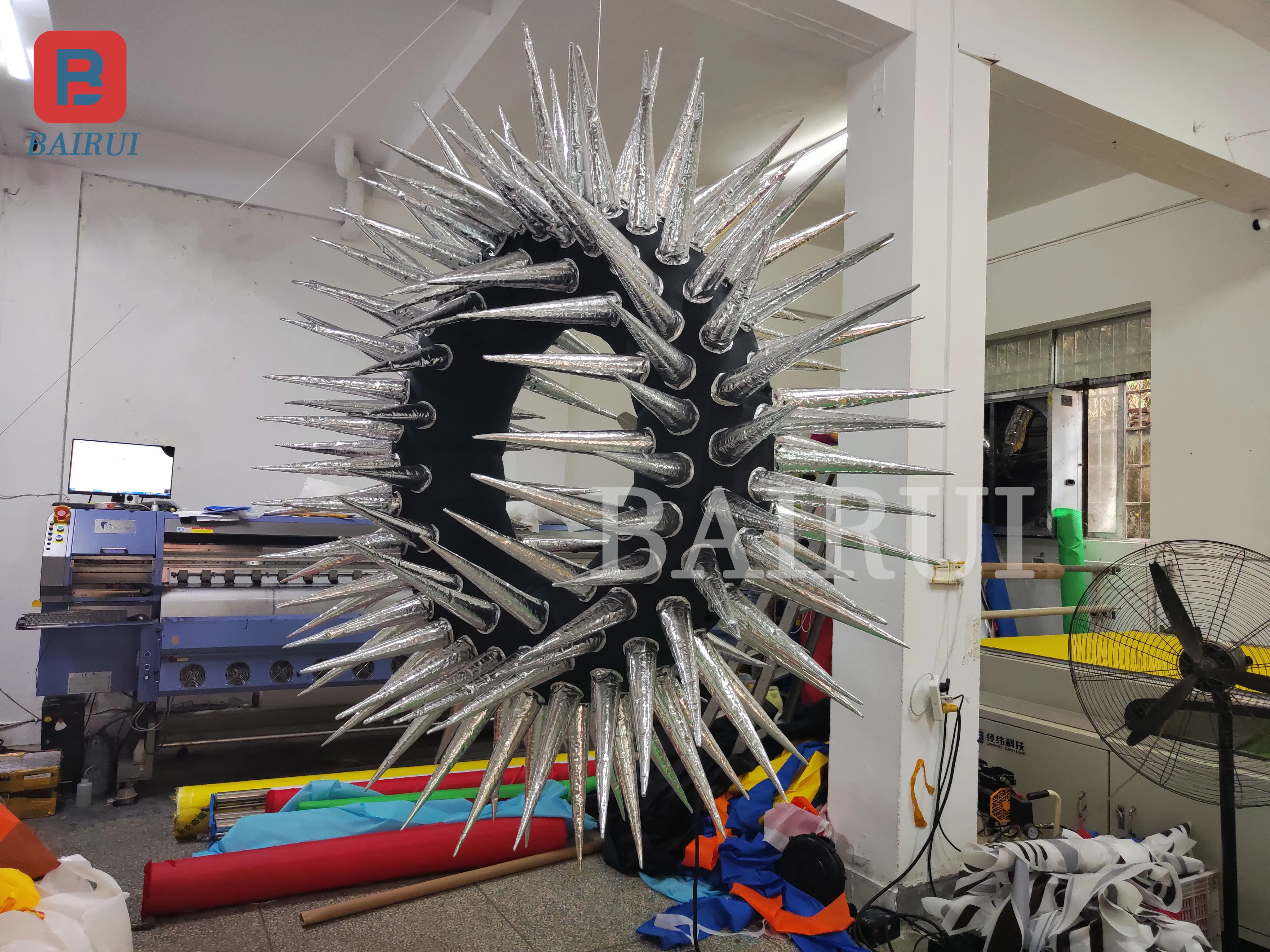 

A spiked inflatable model of the bar hangs lights to decorate the haunted house of the horror Halloween Music Festival