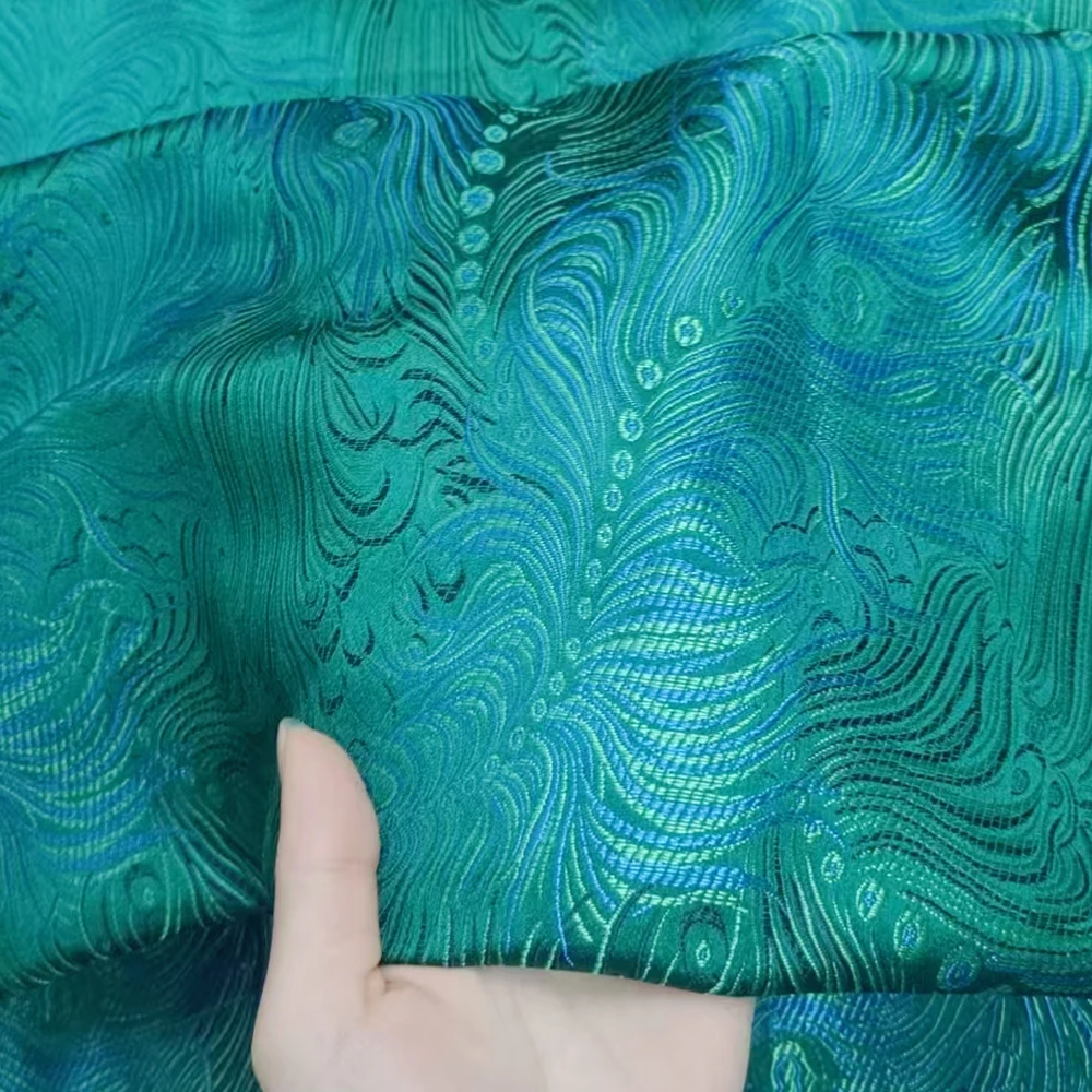 2025 New Atmospheric Green Background Blue Peacock Phoenix Tail Beautiful Curves Woven Silk Satin Fabric Silk Satin Fabric