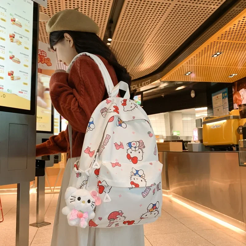 حقيبة ظهر مقاومة للماء من Hello Kitty ، موجة فرشاة للطلاب ، حقيبة مدرسية متعددة الاستخدامات من Sanrio ، جرافيتي للفتيات