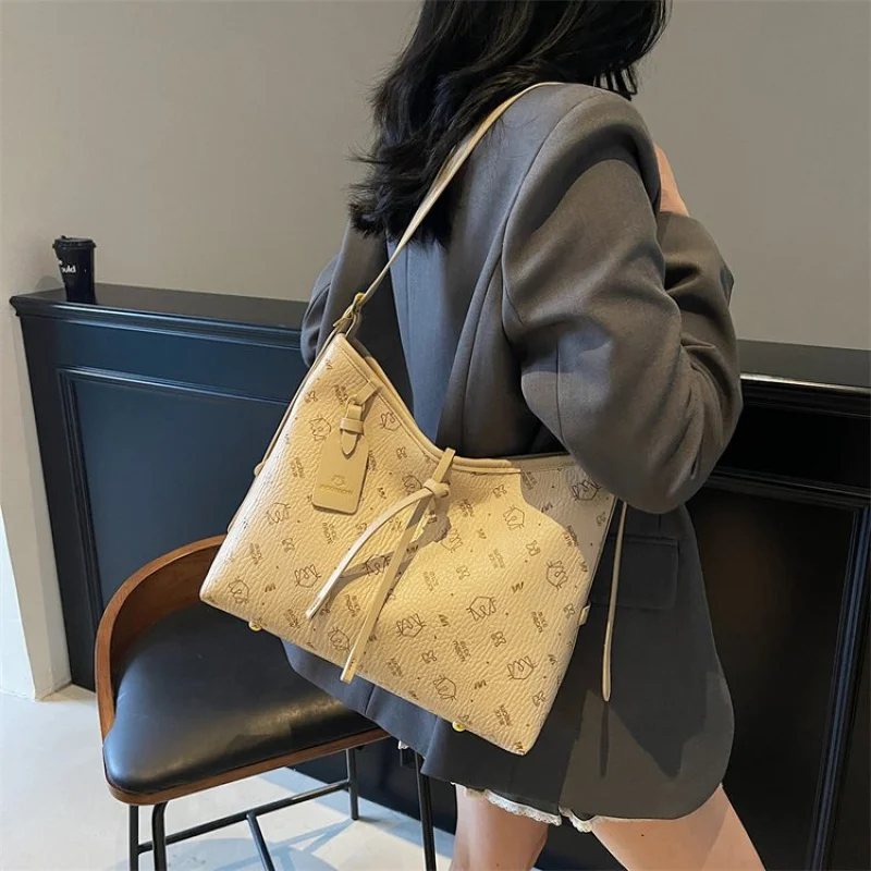 

Trendy Bucket Bag For Ladies In Soft Suede Leather With Drawstring Closure And Modern Sleek Silhouette Design