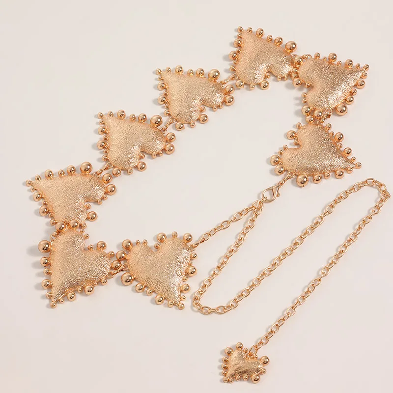 A high-end women's waist chain — a bold metal belt featuring an oversized heart design, adding a unique and stylish touch
