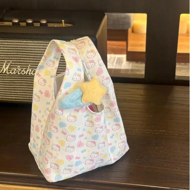 لطيف الكرتون Kawaii Sanrioed Hellokitty 2025 حقيبة المعصم الجديدة المحمولة مفتوحة الأعلى تنوعا باليد حقيبة نسائية للتنقل