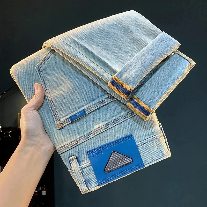 กางเกงยีนส์สีน้ําเงินสําหรับผู้ชายในฤดูร้อนปี 2066 ดีไซน์เพรียวบางทันสมัยระดับไฮเอนด์หลวมลําลองอเนกประสงค์กางเกงครอปยางยืด
