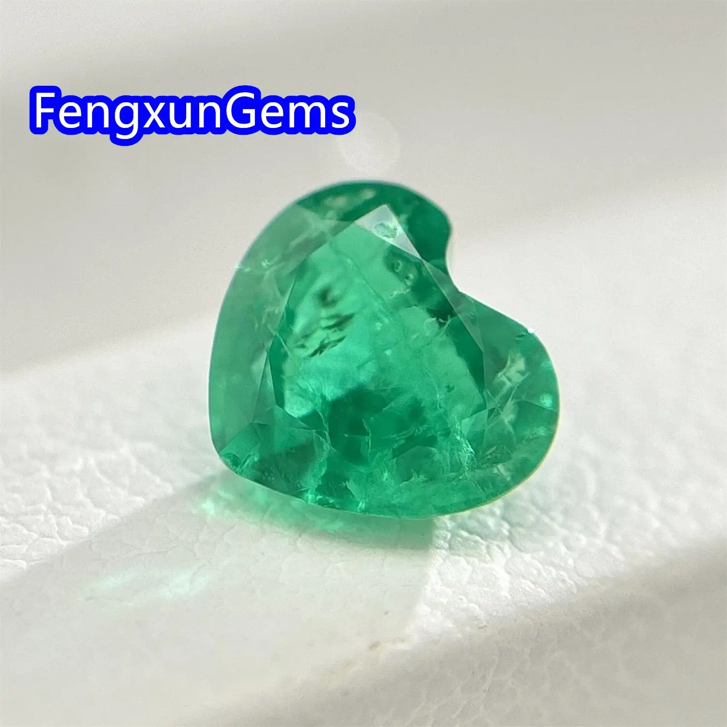 

Lab Grown Colombian Emeralds Heart Cut Hydrothermal Hand Cutting with Cracks Inclusions Inside Selectable AGL Certificate