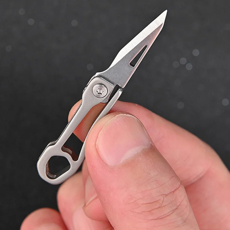 

Titanium Alloy Mini Folding Knife Demolition Express Portable Micro Keychain Pendant High Hardness Folding Portable Sharp Knife