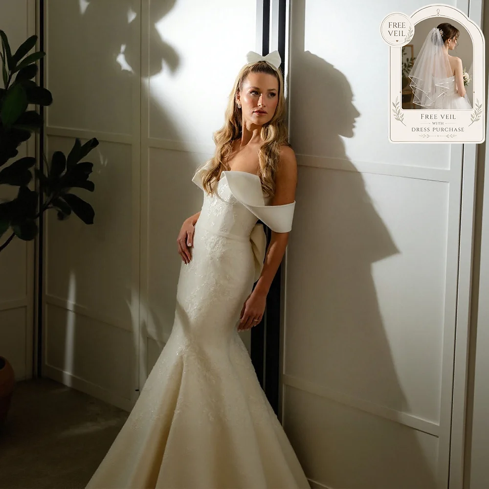 

Off Shoulder Mermaid Wedding Dress 2026 Luxury Satin Applique with Big Bow Back Strapless Bride Gown Customized Vestido De Novia