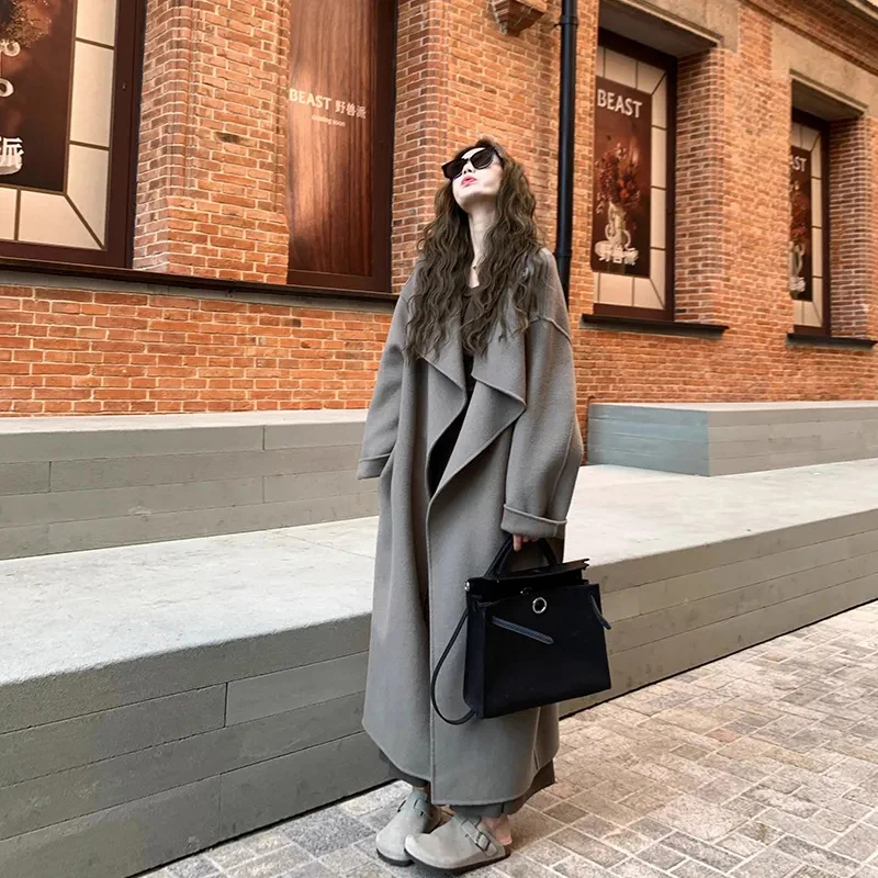 

Длинное серое шерстяное пальто, женское корейское модное свободное повседневное пальто Хепберн, осенне-зимняя теплая однотонная куртка с ленивым поясом