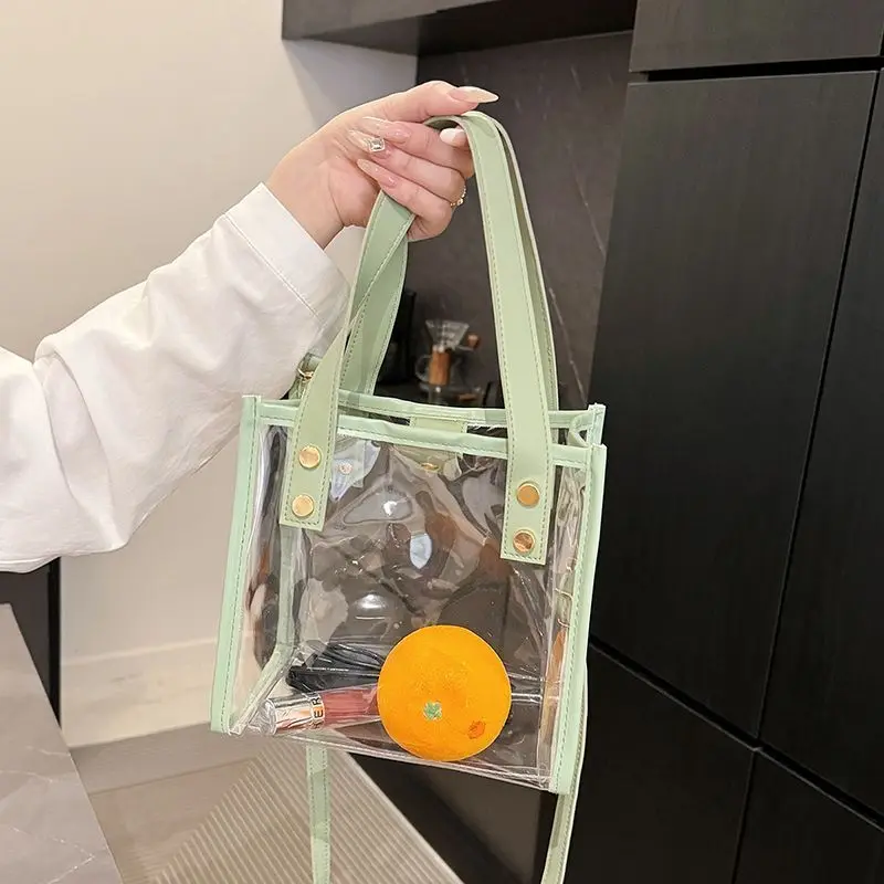 กระเป๋าเยลลี่ใส PVC ยอดนิยมสำหรับฤดูร้อน ดีไซน์ต่อผ้ากันน้ำ กระเป๋าถือผู้หญิงสุดเก๋