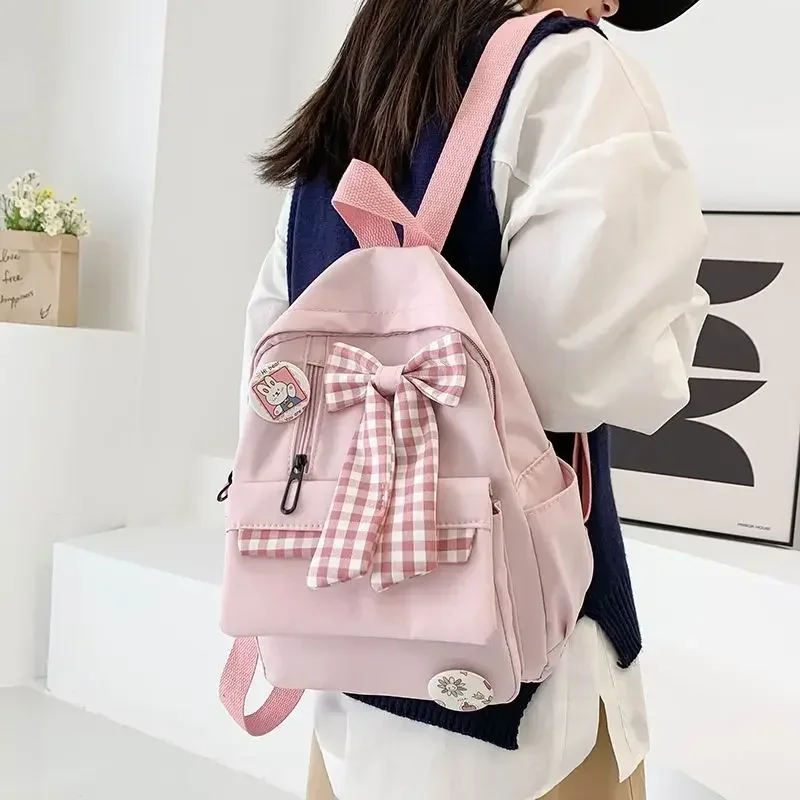 BOMO-mochila Kawaii rosa con pajarita para mujer, bolso de diseño versátil informal con Cremallera de nailon, a la moda, 2024