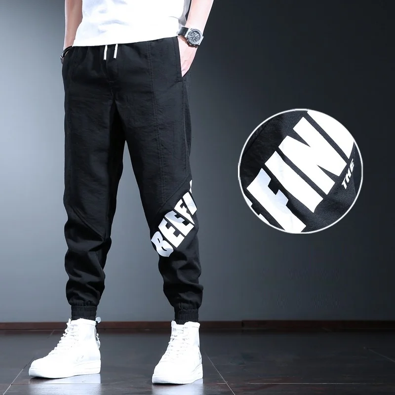 Pantalones deportivos informales para hombre, ropa de calle a la moda, con letras impresas, para correr, color negro, holgados, con cordón