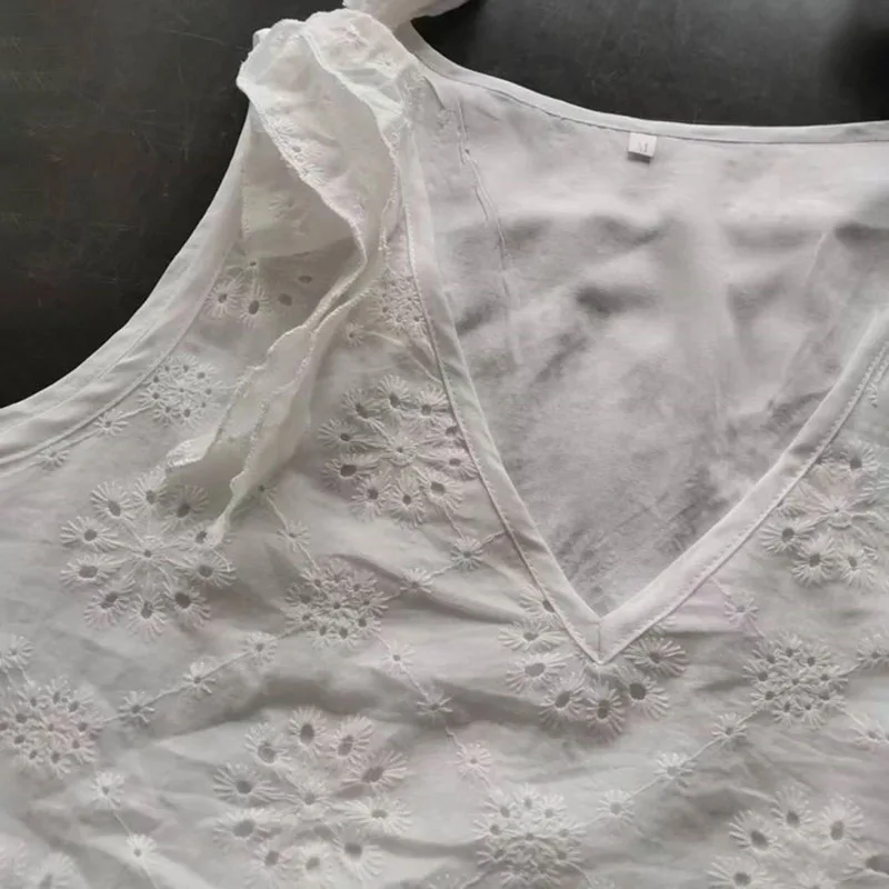 Mini robe blanche élégante pour femmes, Sexy, col en v, œillets brodés, détail noué, sans manches, robe de plage, mode été