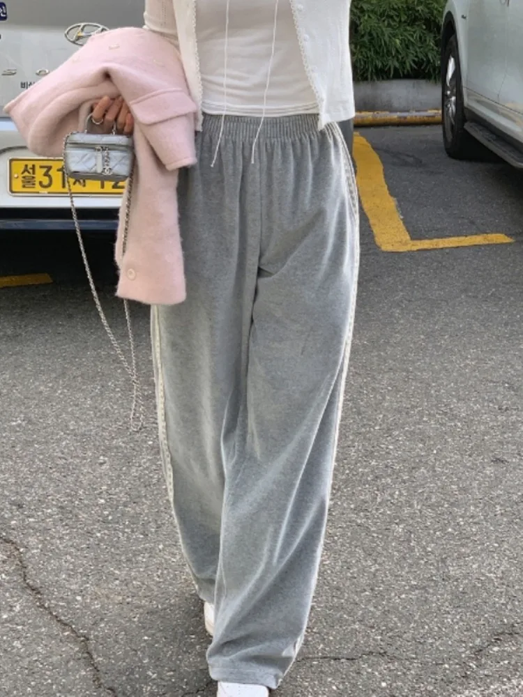 กางเกงขายาวลำลองเอวสูงแต่งขอบลูกไม้สไตล์เรโทรสำหรับผู้หญิง ดีไซน์เก๋ไก๋ ผ้ากำมะหยี่เนื้อนุ่มพลิ้วไหว ทรงขากว้าง แฟชั่นฤดูใบไม้ผลิและฤดูใบไม้ร่วง