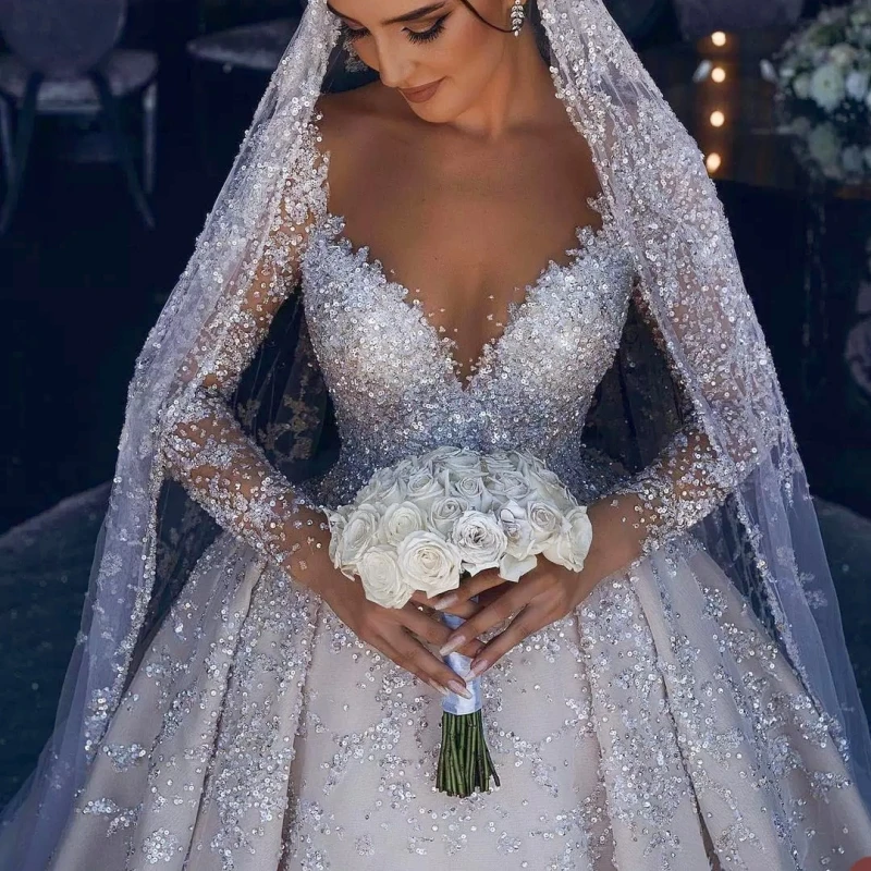 

Luxurious Ball Gown Wedding Dresses Sexy Strapless Lace Long Sleeves V Neck Beads Sequins Appliques Diamonds Arabic Bridal Gown