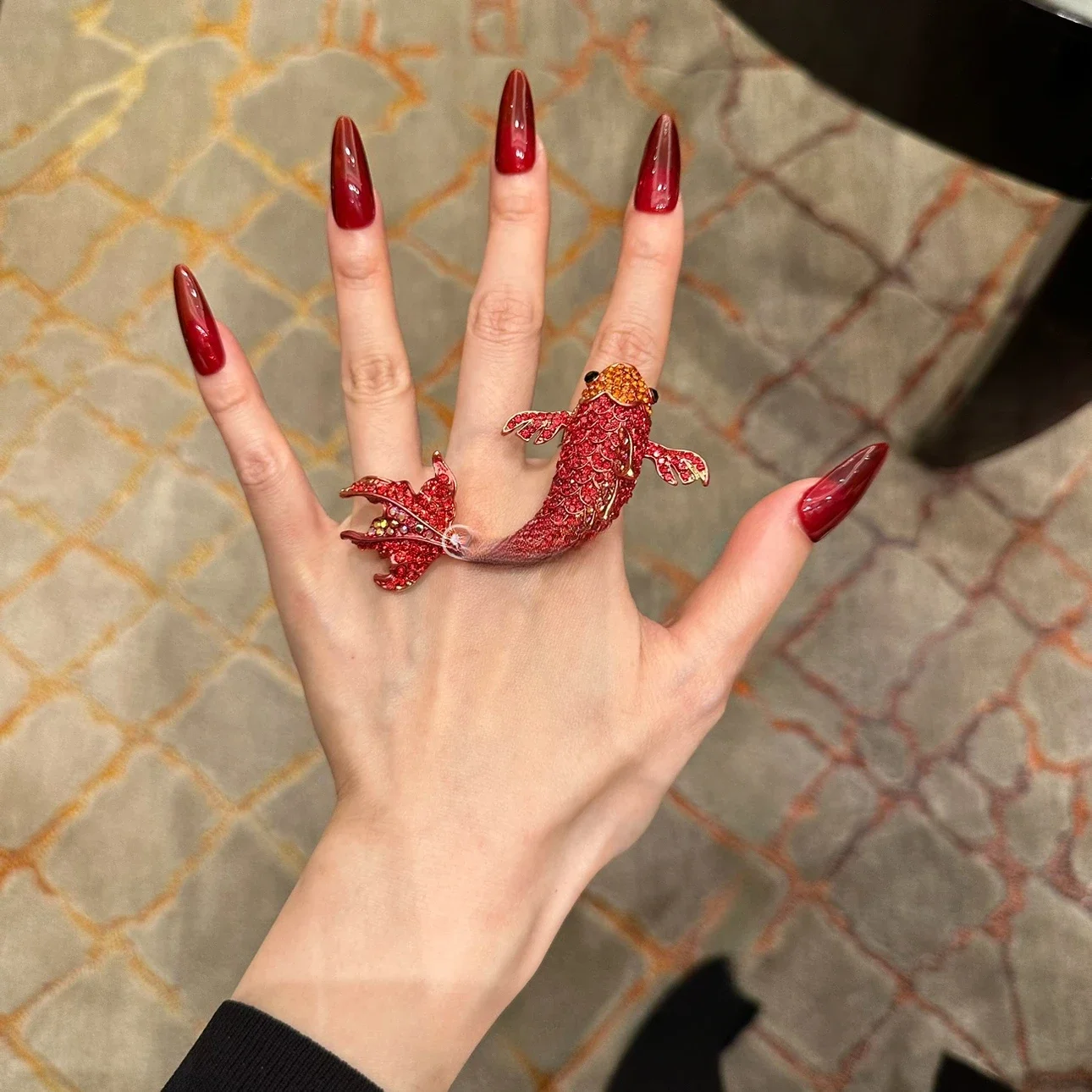 

Niche brand art aesthetic design, big red diamond plated festive red koi ring, light luxury, exaggerated banquet ring