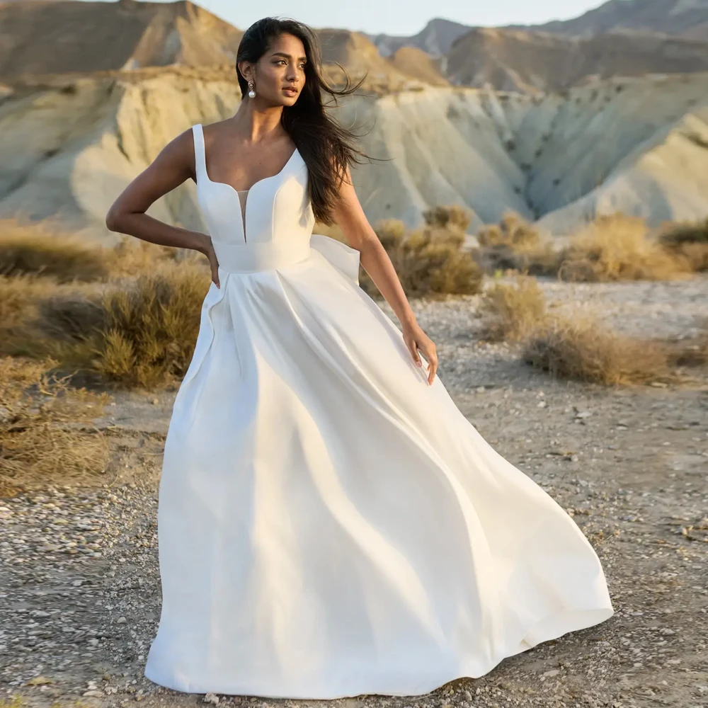 Una linea profondo scollo a V cinturino largo senza maniche abito da sposa in jersey personalizzato abiti da sposa fiocchi aperti sul retro cerniera nuovi abiti da sposa