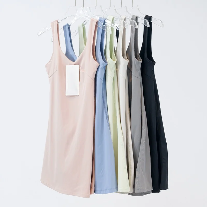 Women's sports dress with built-in short skirt lining, breathable nylon fabric.