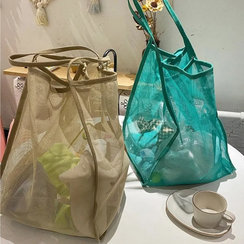 

New transparent mesh shoulder bag, stylish and lightweight, with ample capacity, versatile for shopping, beach bag.