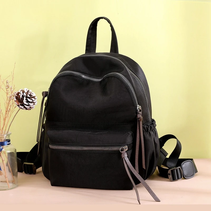 

Europe and the United States backpack new trend of large-capacity fashion Joker light Oxford leisure travel backpack bag.