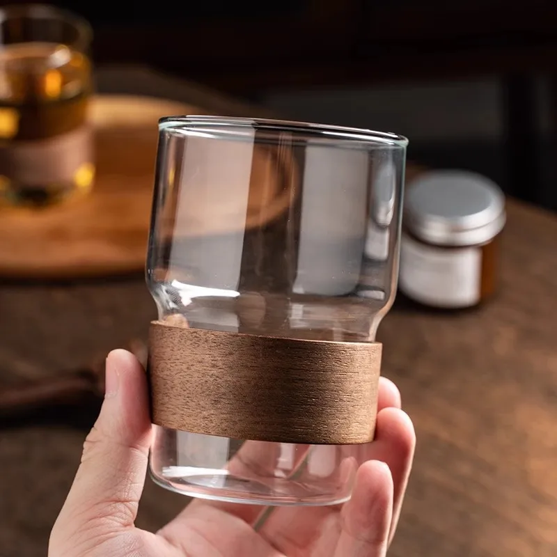 

Coffee Cup with Wooden Heat Insulation Sleeve,Dripping Ear Design for Iced Americano/Latte,Clear Tea Cup,Reusable Office Glass