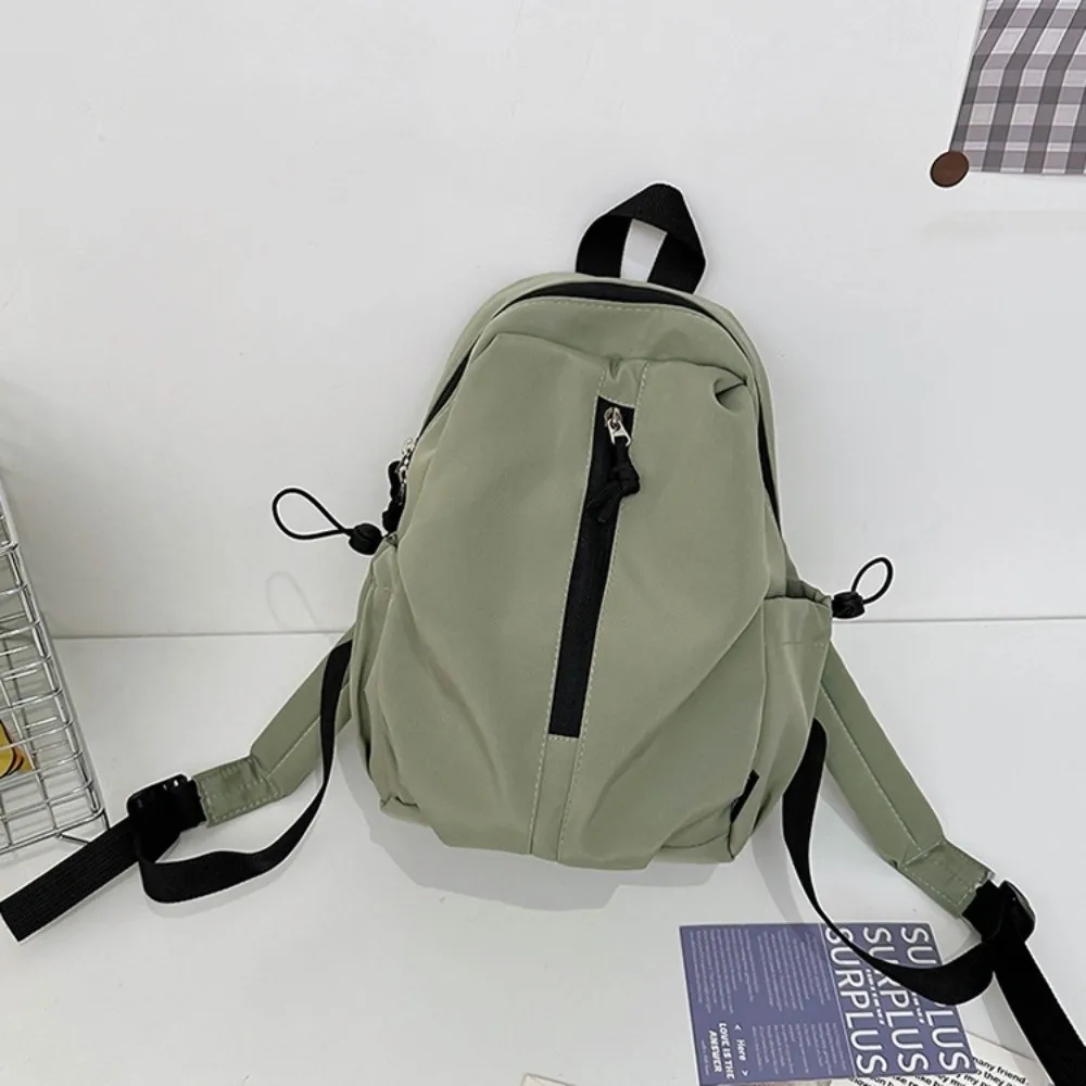حقيبة ظهر عصرية ذات سعة كبيرة وبسيطة مقاومة للماء بلون سادة حقيبة جامعية بسحاب حقيبة كتب خفيفة الوزن في الهواء الطلق