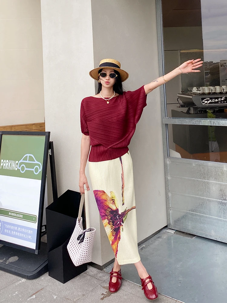 Damska spódnica midi na lato 2025, z wysokim stanem, luźna, elastyczna, w stylu vintage, z modnym nadrukiem, idealna na podróże i do noszenia na co dzień.