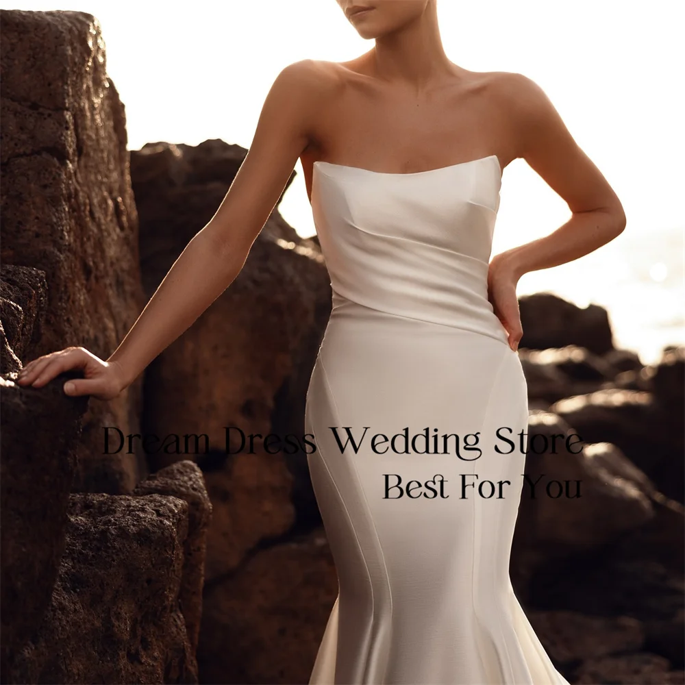 DREAM Abito da sposa moderno con pieghe a sirena 2025 Abito da sposa in raso con scollo a barca aperto sul retro con strascico lungo Abiti da sposa personalizzati