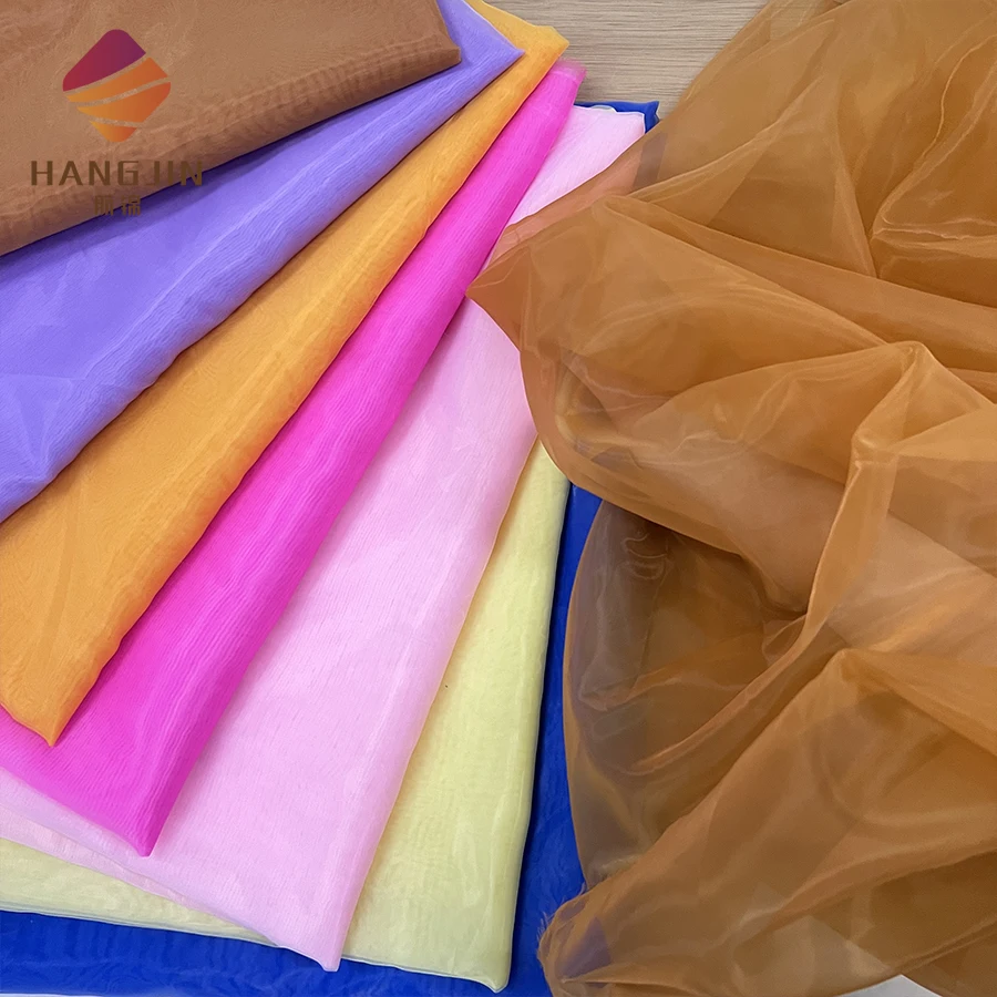 

Factory High Quality 100% Polyester Mesh Soft Sheer Tulle Silk Chiffon Fabric Shiny Luster Organza Fabric for Evening Dress