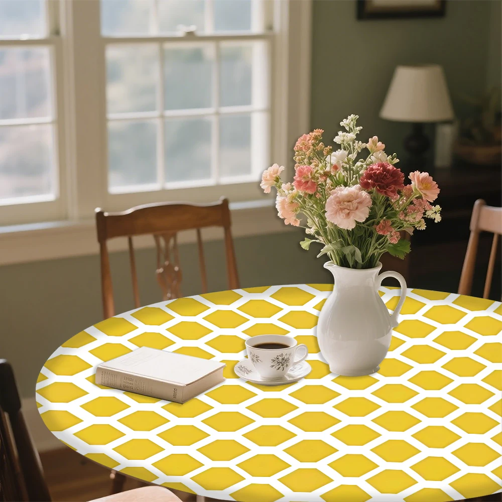 The round elastic tablecloth features a yellow and white hexagonal pattern. Made of polyester, it's suitable for indoor dining r