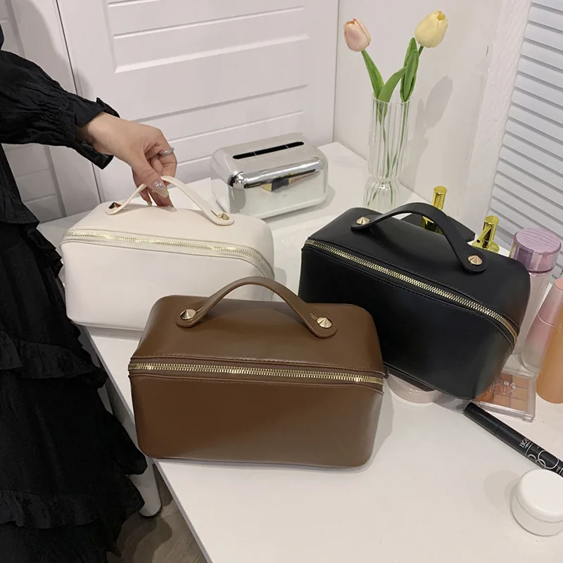 Bolsa de maquillaje portátil de gran capacidad para mujer, estuche de cosméticos de viaje avanzado de cuero, a la moda, 2023