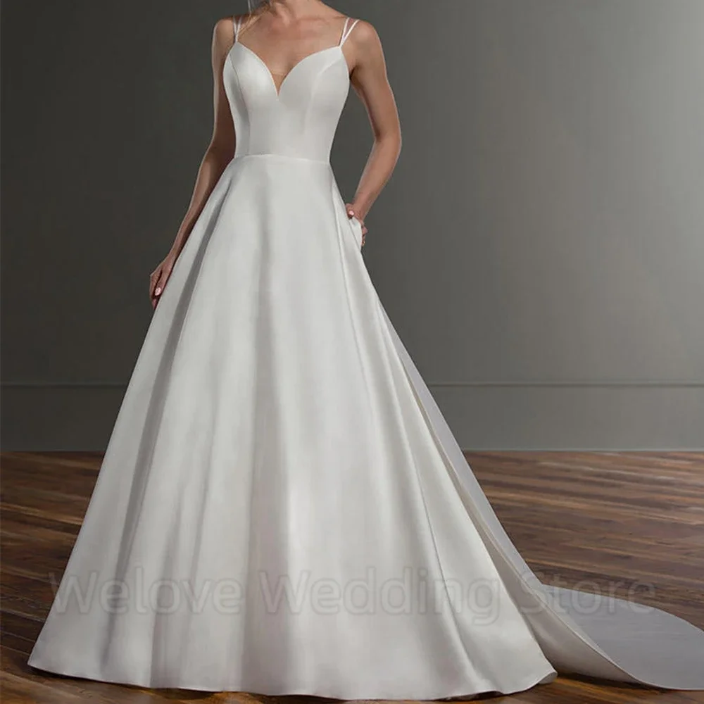 فستان زفاف بسيط بحمالات رفيعة مزدوجة مثير مفتوح الظهر بدون أكمام على شكل حرف a طول الأرض فساتين زفاف من الساتان للزواج