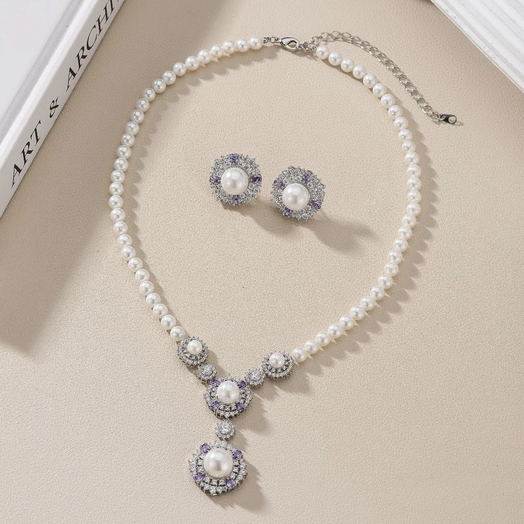 

Женская мода Цвет Цирконий Жемчуг Цветок Листья Серьги Ожерелье Комплект 2025