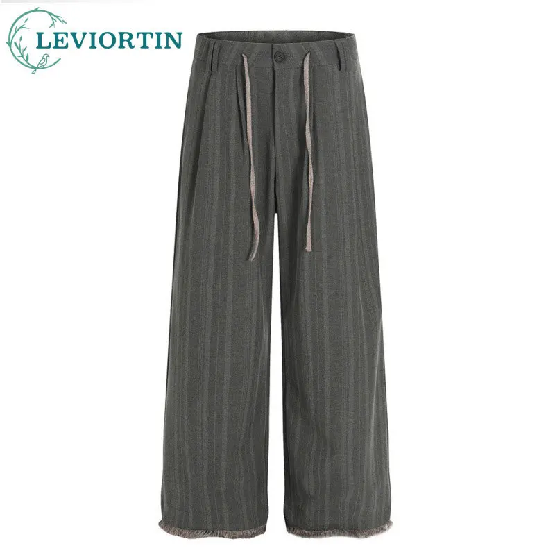 

American retro style casual pants for men's street fashion featuring a fringed edge design and wide leg loose straight leg pants