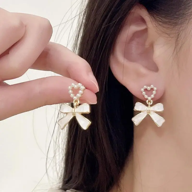 925 Silver Needle Korean Fashion White Bow Drop Earrings For Women Jewelry 2026 Trending New Women\'s French Pearl Earrings JN9
