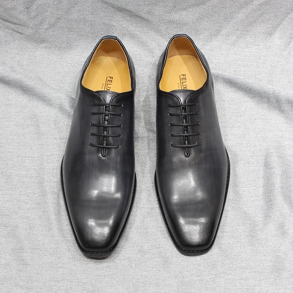 Scarpe eleganti Oxford da uomo con taglio intero in vera pelle classica scarpe formali da uomo fatte a mano da ufficio firmate in tinta unita