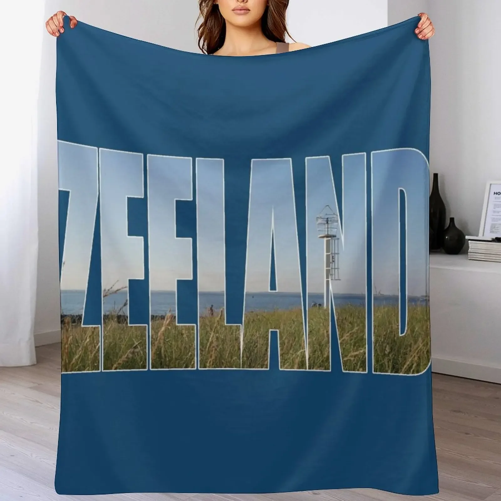 Text Zeeland with overlay of a land and sea landscape in a photo of zeeland in the Netherlands Throw Blanket