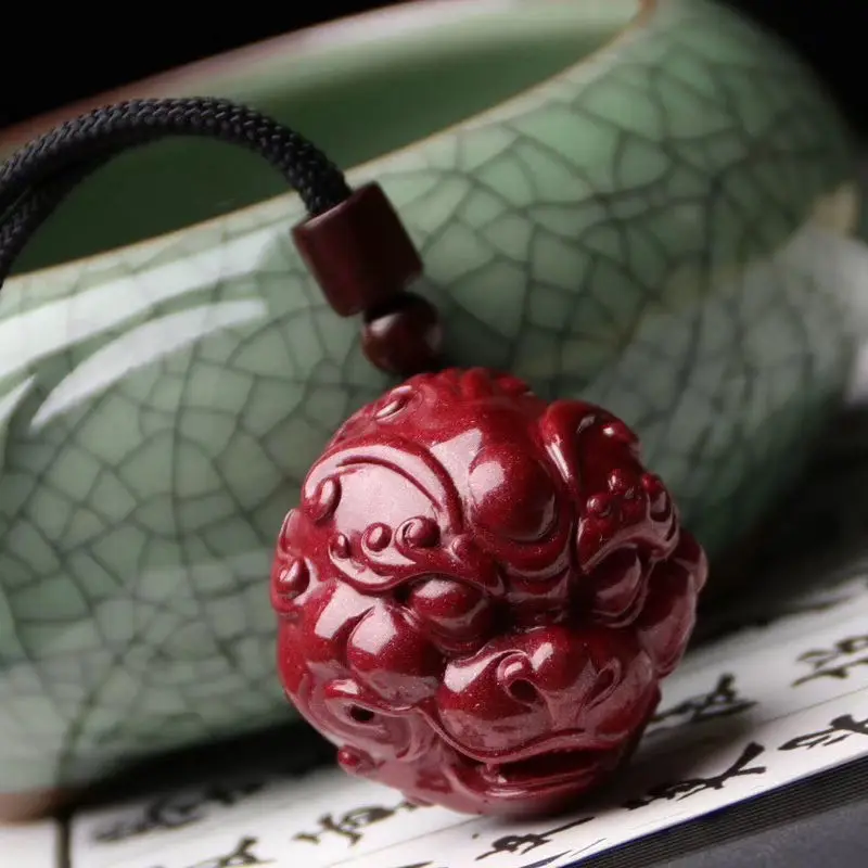 

Natural Cinnabar Pi Xiu Pendant High-Content Raw Ore Purple Gold Sand Beast Head Nafu Wholesale