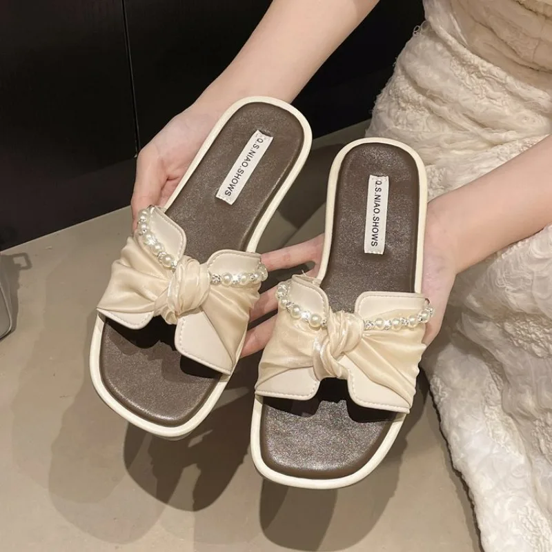 

Hot Selling 2026 Fashionable Flat Bottom Slippers for Women Indoor Outdoor Wear Knot Summer New Style Fairy Style Home Slippers