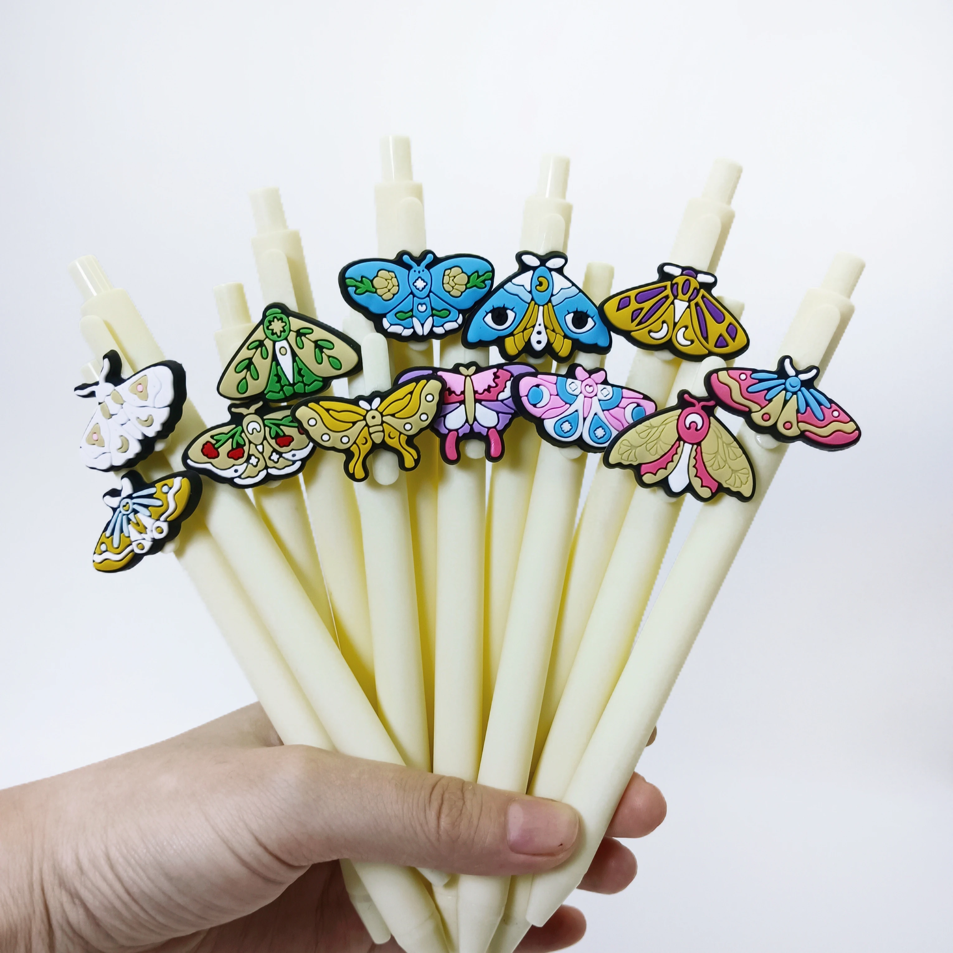 

12PCS Moth series neutral pen, beige patch creative gift pen PVC soft rubber material push pen