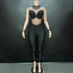 Celebrity's sparkling large rhinestone transparent jumpsuit for birthday celebration, luxurious attire for dancers' performances