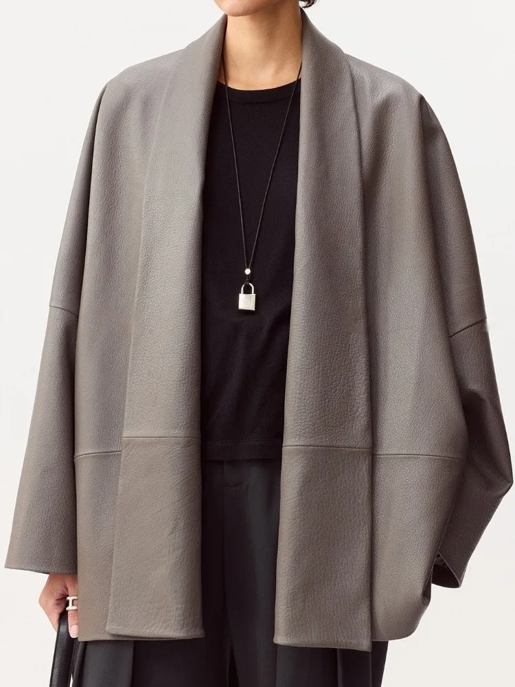 เสื้อแจ็คเก็ตหนังแท้สีพื้นสำหรับผู้หญิง ทรงหลวม คอวี แขนยาว ทำมือ ดีไซน์หรูหราทันสมัย ผลิตจากหนังแกะ