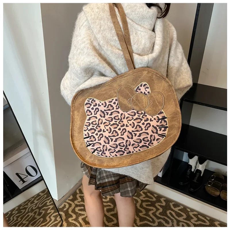 Sanrio Hello Kitty cartoon leopard print fashion women's backpack new large capacity PU pitot bag casual shoulder messenger bag