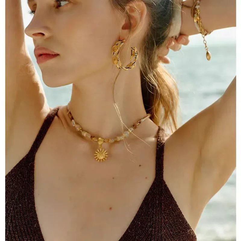 New Rising Sun knot earrings, unique high-end vacation style, exquisite hollow woven earrings, niche design earrings, women