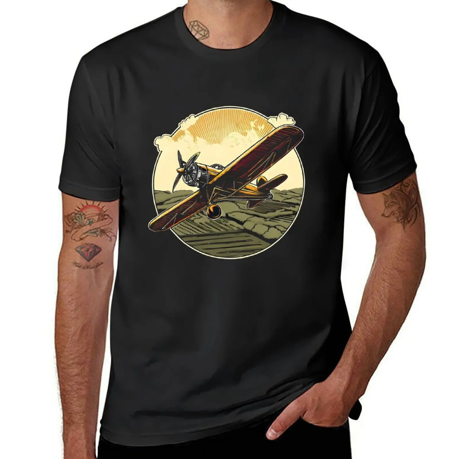 A vintage biplane soaring over a countryside with a propeller spinning in motion. T-shirt oversizeds funnys anime Men's clothing