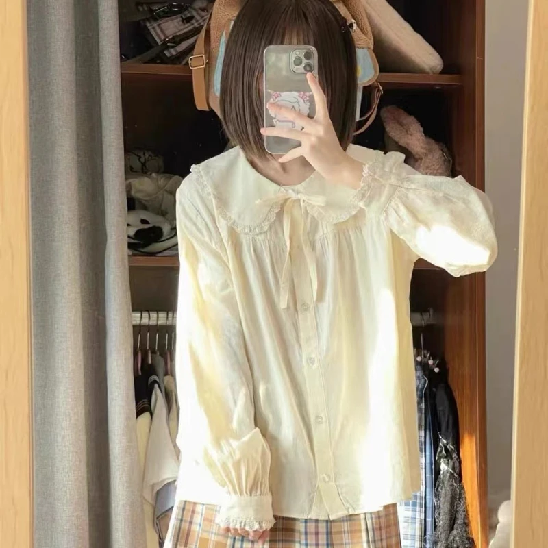 เสื้อเชิ้ตคอปีเตอร์แพนสไตล์ญี่ปุ่นน่ารักสำหรับผู้หญิง เสื้อแขนยาวผูกโบว์หวานๆ เสื้อทรงหลวมติดกระดุม เข้าได้กับทุกชุด สไตล์ Y2k